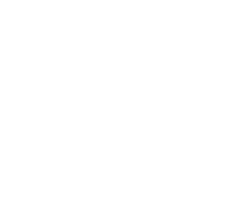 Photo of Alexandra Maccoll Garfinkel sitting outside in Denmark wearing a grey jacket.