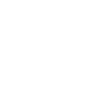 Photo of Alexandra Maccoll Garfinkel sitting outside in Denmark wearing a grey jacket.